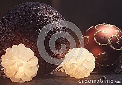 Decorative multicolor christmas balls with glowing cones on dark background. Stock Photo