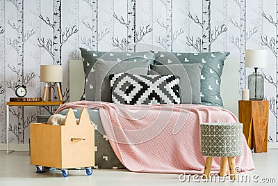 Decorative pillow in feminine bedroom Stock Photo