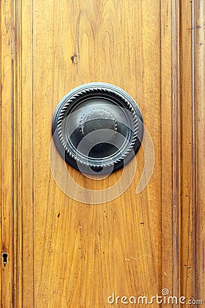 Decorative round door knocker on a wooded door Stock Photo