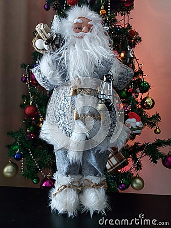 Decorative Santa Claus with a christmas tree Stock Photo