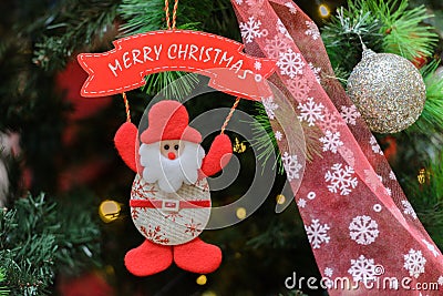 Decorative santa claus merry christmas on christmas tree close-up Stock Photo
