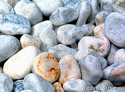 Decorative smooth white river stone pebbles in closeup view. Stock Photo