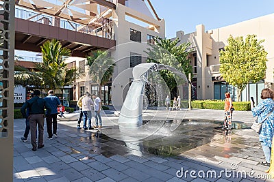 The decorative whale tail fountain on the Pointe - seaside promenade of the Palm Jumeirah island in Dubai city, United Arab Editorial Stock Photo