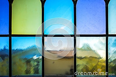 Decorative window with various colored rectangles stained glass Stock Photo