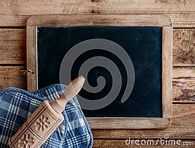 Decorative wooden rolling pin on an old slate Stock Photo