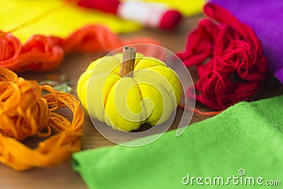 Decorative yelllow pumpkin made from felt Stock Photo