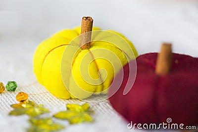 Decorative yelllow and red pumpkins made from felt Stock Photo