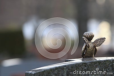 A decotive angel sculpture on a gravestone Stock Photo