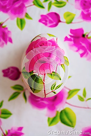 Decoupage Easter egg, Decorated with flowered paper napkins above view Stock Photo