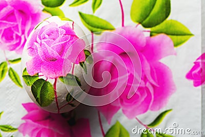 Decoupage Easter egg, Decorated with flowered paper napkins above view Stock Photo