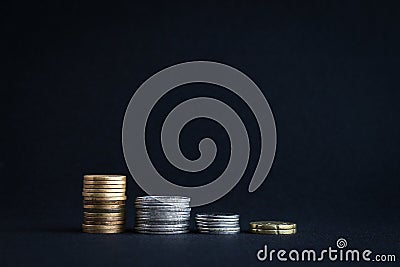 Decrease graph made of stacked coins Stock Photo