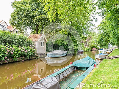 Canal with boats in old town of Broek in Waterland, Netherlands Stock Photo