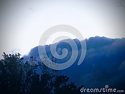 Deep blue clouds sit in the background as winter begins its approach Stock Photo