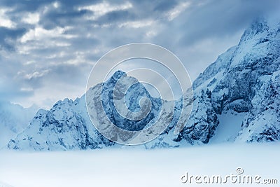 Deep blue panorama of winter landscape with mountains, Dombaj, Russia Stock Photo