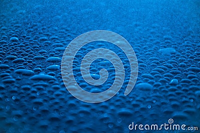 Deep blue raindrops abstract background. Stock Photo