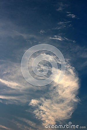 Deep blue skies with puffy cloud cover that begins to make way for the sunny morning ahead Stock Photo