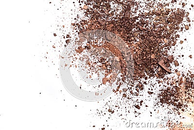 Deep brown crumbled eye shadow isolated on white background.Broken brown eyeshadow palette isolated on a white background Stock Photo