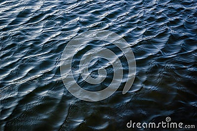 Deep dark blue river surface texture ripple water background Stock Photo