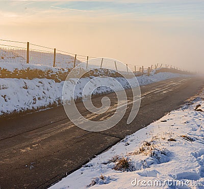 A deep fog rises from a country road in the middle of winter, 2019 Stock Photo