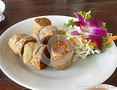 Deep Fried Crab Meat Rolls on white dish Stock Photo