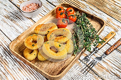 Deep fried crispy onion rings breaded. White wooden background. Top view Stock Photo