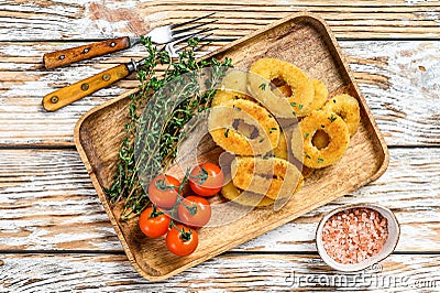 Deep fried crispy onion rings breaded. White wooden background. Top view Stock Photo