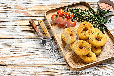 Deep fried crispy onion rings breaded. White wooden background. Top view. Copy space Stock Photo