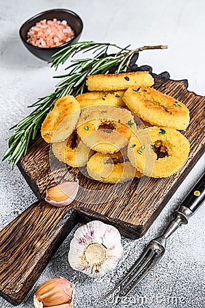 Deep fried crispy squid and onion rings breaded. White background. Top view Stock Photo