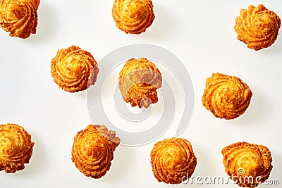Deep fried decorative twirls of crispy potato Stock Photo