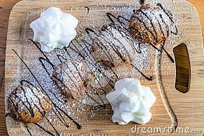 Deep fried oreo cookies on wooden tray Stock Photo