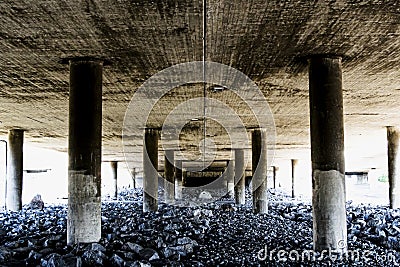 Deep and rough perspective from under a concrete bridge Stock Photo