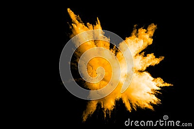 Deep Yellow color powder explosion cloud isolated on black background Stock Photo