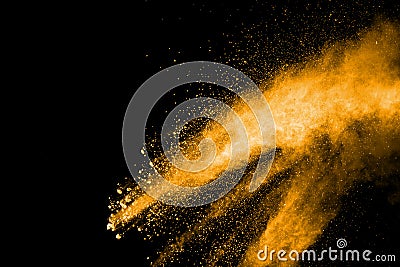 Deep yellow dust particle splattered on black background. Stock Photo