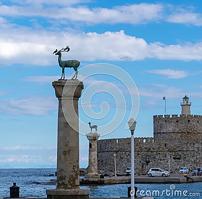 The deer of Rhodes in the entrance of the port Editorial Stock Photo