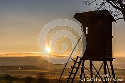 deerstand at sunrise with backlight Stock Photo