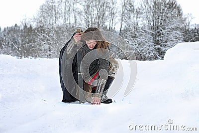 Defender the young warrior in mail armor armed with a sword Stock Photo