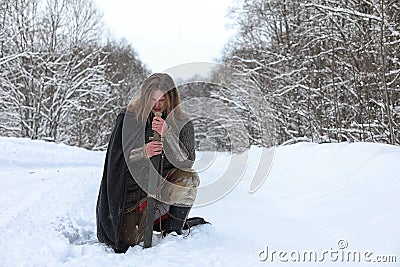 Defender the young warrior in mail armor Stock Photo