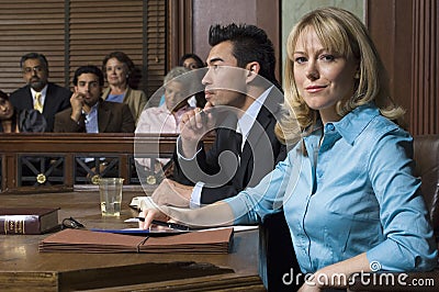 Defense Lawyer With Client In Court Stock Photo