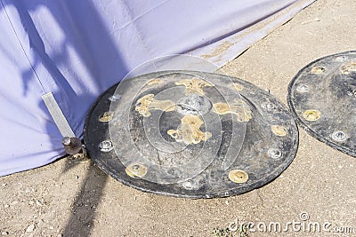 Defense, medieval shields next to war tent Stock Photo