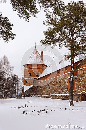Defensive stone walls of historical Trakai castle covered with snow, Lithuania. Winter landscape Stock Photo