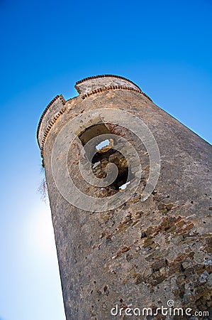 Defensive tower with sun behind Stock Photo