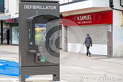 A defibrillator or AED in a telephone box on a high street, Commercial road, Portsmouth Editorial Stock Photo