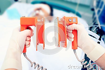 Defibrillator electrodes in hands Stock Photo