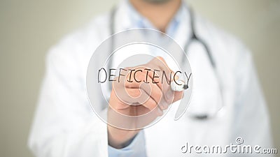 Deficiency , Doctor writing on transparent screen Stock Photo