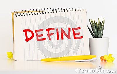 Define. Define word on notebook sheet with some colorful crumpled paper balls on it Stock Photo