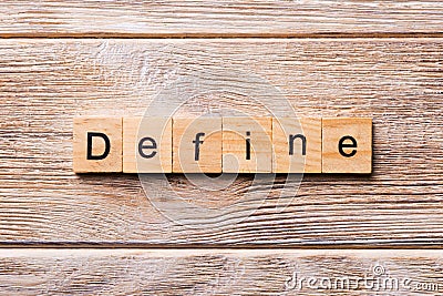 Define word written on wood block. Define text on wooden table for your desing, concept Stock Photo