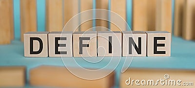 DEFINE word written on wooden blocks on light blue background Stock Photo