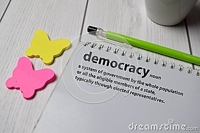 Definition of Democracy word with a meaning on a book. dictionary concept Stock Photo