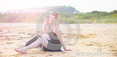 Defocus Banner Young woman mom holding a baby boy outdoors. Stock Photo