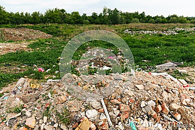 Defocus huge ruins, wreck in Ukraine, war. House after russian attack. Large garbage pile on nature green grass Stock Photo
